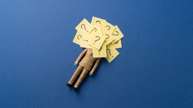 Burden of Questions Mannequin drowning in doubt on blue background.