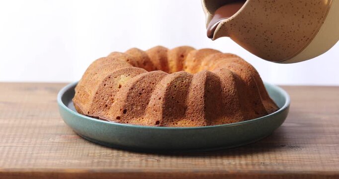 Brazilian carrot cake, bolo de cenoura, with chocolate glaze on the plate. Dessert, baked, delicious.