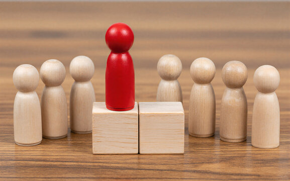Red figure stands before "YES" and "NO" blocks surrounded by wooden