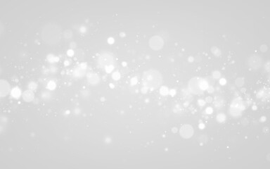 Soft white particles drift over a dark background, forming sparkling bokeh. PNG transparency ensures versatile use in digital artwork. © Extrastock