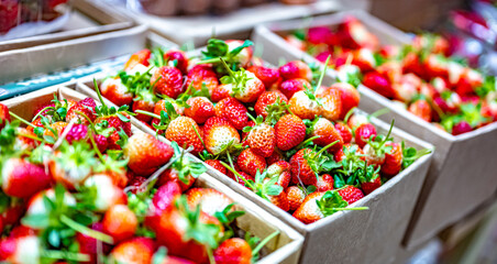 Fresh strawberries put out for sale in a grocery store