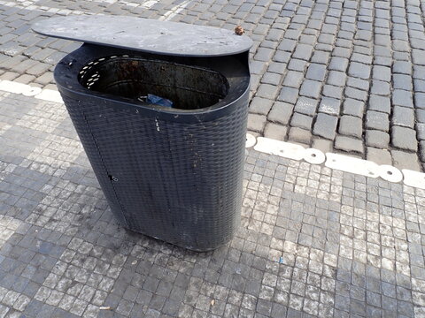 city street rubish bin on a pavement
