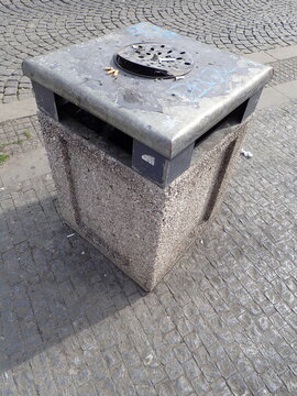 city street rubish bin on a pavement