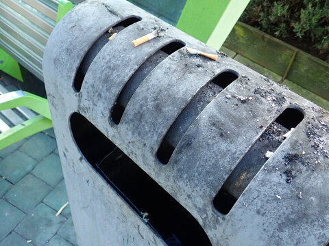 city street rubish bin on a pavement