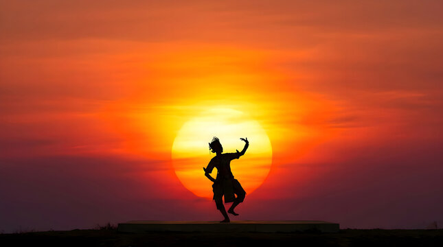 Silhouette of Thai Khon Dancer Performing at Sunset with Big Sun