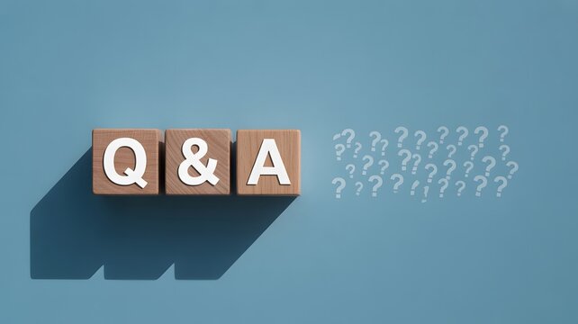 Questions and Answers concept with wooden blocks and numerous question marks on a blue bac