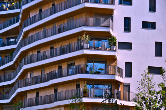 Paris, France - April 18th 2015 : Focus on modern buildings, built close to the Porte d'Auteuil, on the western side of Paris. Focus on a nice building, with wooden balconies. 