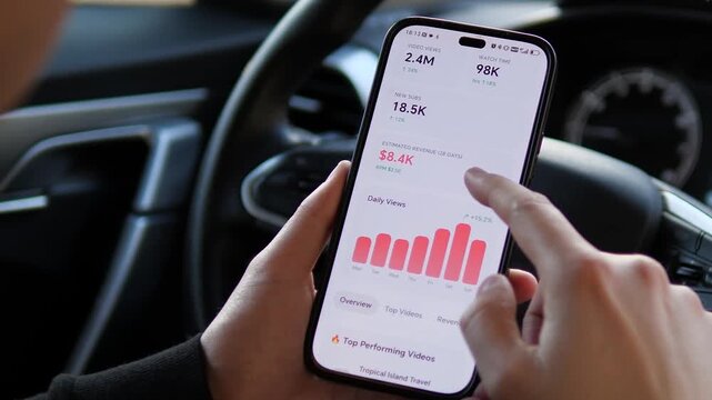 Video blogger reviews travel vlog stats on a smartphone. UI shows 2.4M views and 8400 dollars revenue. Ideal for digital nomad, passive income, and social media success themes. High-quality