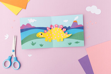 Dinosaur paper art craft for children family leisure activity creative development tools kids entertainment stegosaurus project parenting blog imagery childhood hobby handmade card © Elena