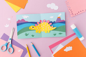 Paper craft dinosaur kids activity art project school supplies creative hobby colorful diy background stegosaurus preschool education handmade background scrapbooking creative play © Elena