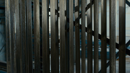 Obraz premium Abstract Dark Wooden Slat Fence Pattern with Light Contrast