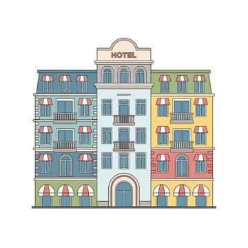 Colorful hotel building with awnings, balconies, and mansard roofs, isolated on white