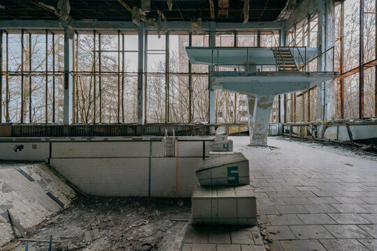 View of the abandoned Azure Swimming Pool with diving boards and starting blocks in Prypyat, Kyiv Oblast, Ukraine.