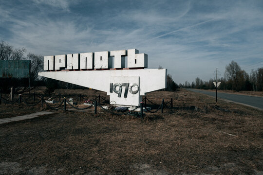 View of the iconic concrete entrance sign to the abandoned city of Pripyat under a cloudy sky in Pripyat, Kyiv Oblast, Ukraine.