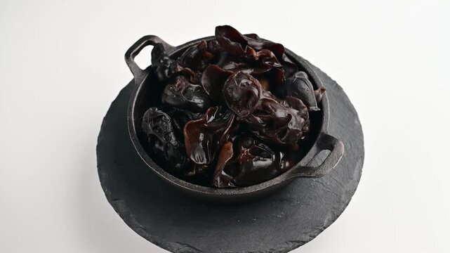 Cooking with dried chilies in a kitchen setup during daytime for flavorful dishes