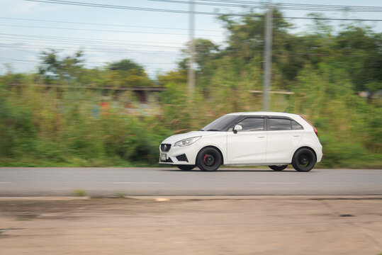 Nakhonsawan, Thailand - Oct, 2025: MG MG3 hatchback, A white car to speed running on the highway, on October 24, 2025, at Nakhon Sawan, Thailand.