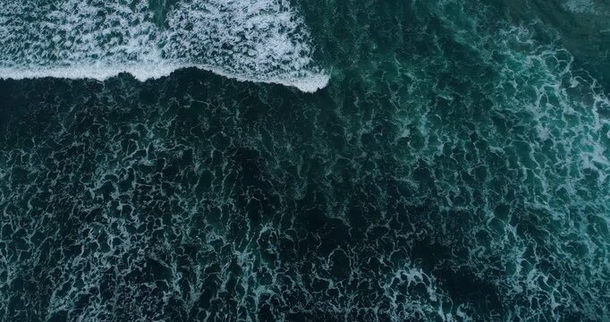 Aerial Top View of Ocean Waves Forming Patterns on Beach