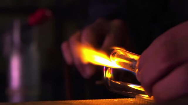 Neon Glass Tube Being Heated by Moving Blowtorch in Workshop, Close Up - 4K