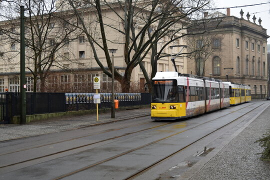 Yellow tram M1 passing by the Maxim Gorki Theater in Berlin, Germany, January 2016. 