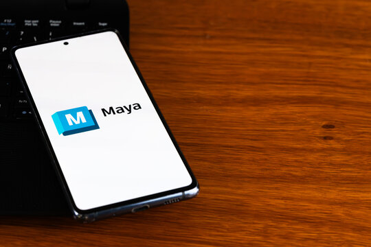 Punta Arenas, Chile &ndash; March 31, 2026: The Autodesk Maya logo and branding displayed on a smartphone screen resting on a wooden desk