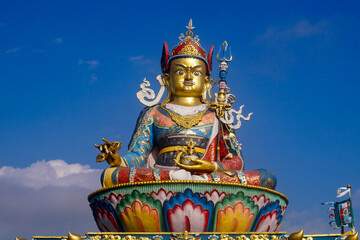 Fototapeta premium Statue of Guru Padmasambhaba or Guru Rinpoche, a revered figure in Tibetan Buddhism, located near Delo Park in Kalimpong West Bengal India. 