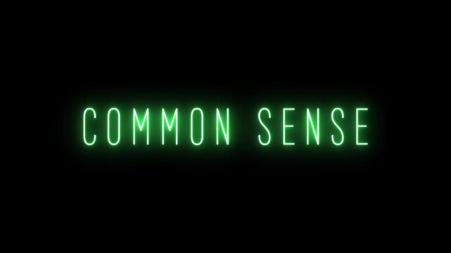 The concept COMONSENSE written in glowing green neon letters with a digital glow effect against a dark black background signifying logic and practical reasoning Keywords: common sense