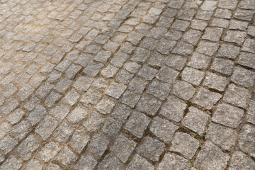 Naklejka premium Cobblestone pavement texture background, urban street pattern.