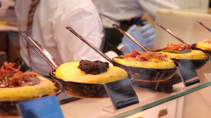 Fototapeta premium Potato omelet shop in the San Miguel market in Madrid