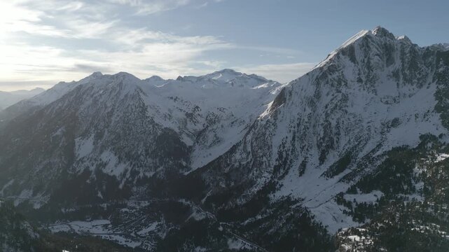 Dramatic winter landscape of the Pyrenees mountains with rugged peaks and deep valleys