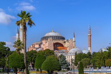 Naklejka premium Hagia Sophia Mosque view from Sultanahmet Square in Istanbul, Turkey. Byzantine architecture with domes under sunny blue sky