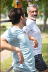 Fototapeta premium two man runners standing talking after running