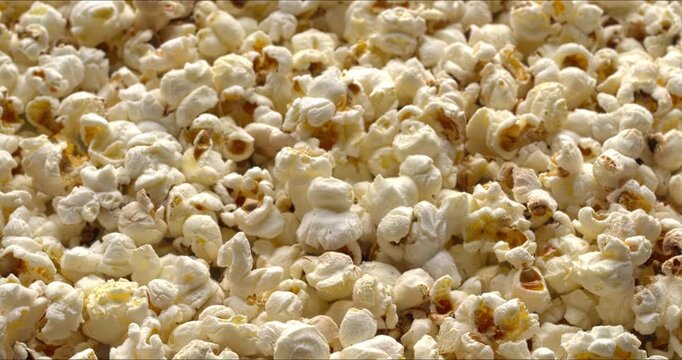 Homemade popcorn as a food background texture - selective focus, table spin.