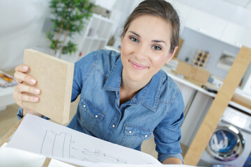 a woman working with wood