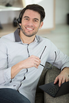 happy man relaxing at home on a sofa