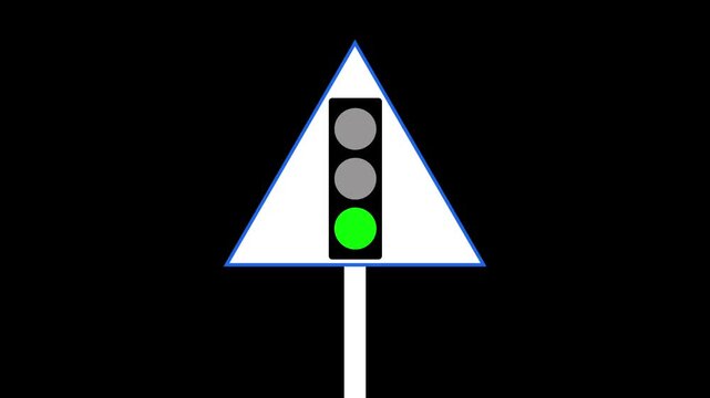 The bottom green light is illuminated on this traffic signal while a green go sign is visible on the right side. 4k video,.......,..