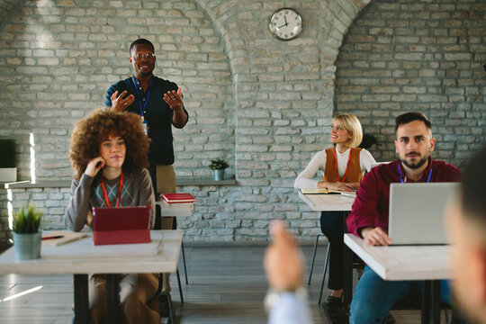Diverse startup team attending an engaging business conference training