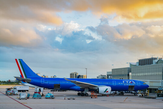 Miami, Florida, USA - October 30, 2025: Airport terminal with Airbus A330-941. Airbus A330-941, ITA Airways. Plane arrival of ITA Airways. Departure and arrival at airport terminal. Airplane terminal