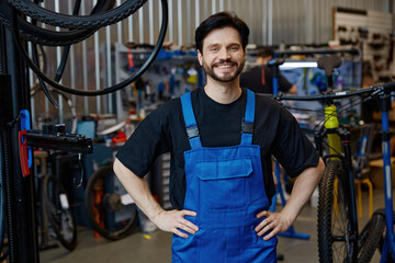 Skilled technician with bright smile at repair shop © Nomad_Soul
