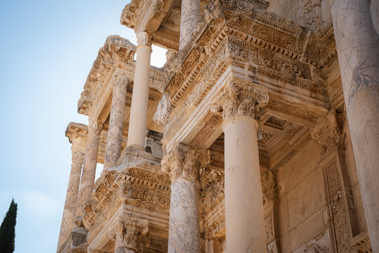 Detailed view of Celsus Library facade in Ephesus with ornate marble columns and classical Roman architectural elements in historical archaeological site