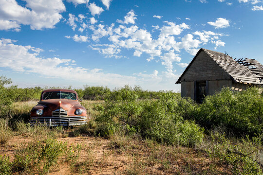 Abandoned Car and Desert House Along Historic Route 66