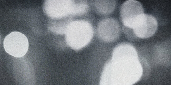 A pixelated image of white spots on a dark background