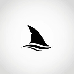 Fototapeta premium Shark fin silhouette emerging from ocean waves minimalist design black and white.