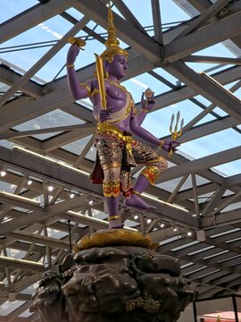 Purple Vishnu Statue from the Churning of the Milk Ocean Display at Suvarnabhumi Airport, on March 26, 2026 in Bangkok, Thailand.