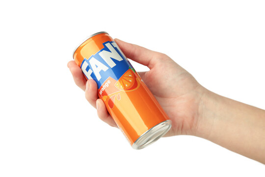 Mykolaiv, Ukraine - March 25, 2026: Female hand holds Fanta can isolated on white background.