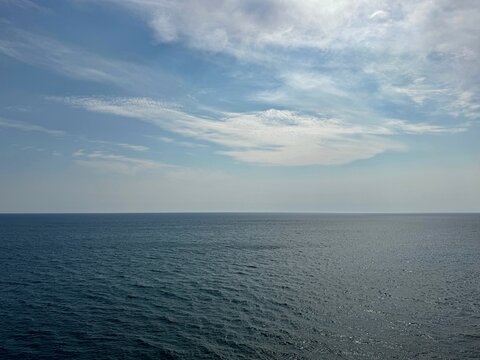 Open sea and blue cloudy sky.