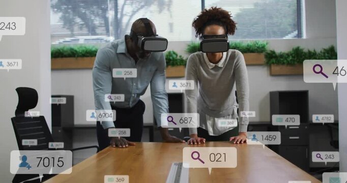 Two pros leaning on table VR headsets starting tech HUD bubbles woman tapping man reviewing metrics