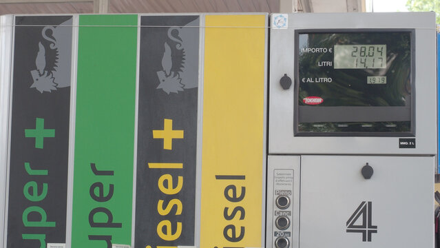Close-up of a modern fuel pump display showing the cost per liter and total amount paid for gasoline and diesel
