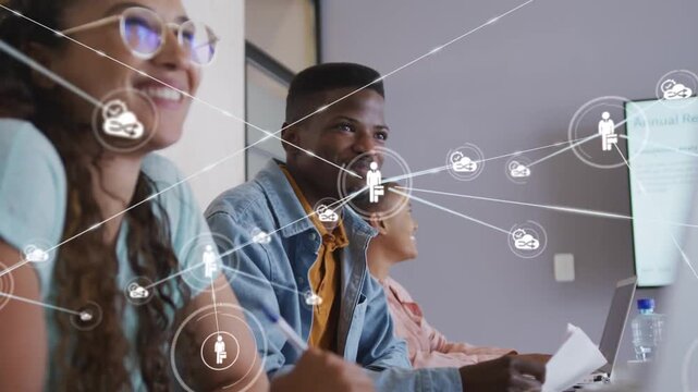 Vertical video: Coworkers watching training monitor starting network overlay, camera moving closer