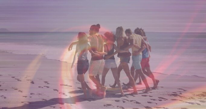 Lead person stepping forward, seven adults linking, walking beach for travel, color bands crossing