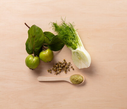 Still Life of Fresh Green Vegetables on a Wooden Table